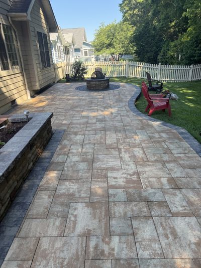 Same stamped patio after cleaning, staining removed and warm tone restored